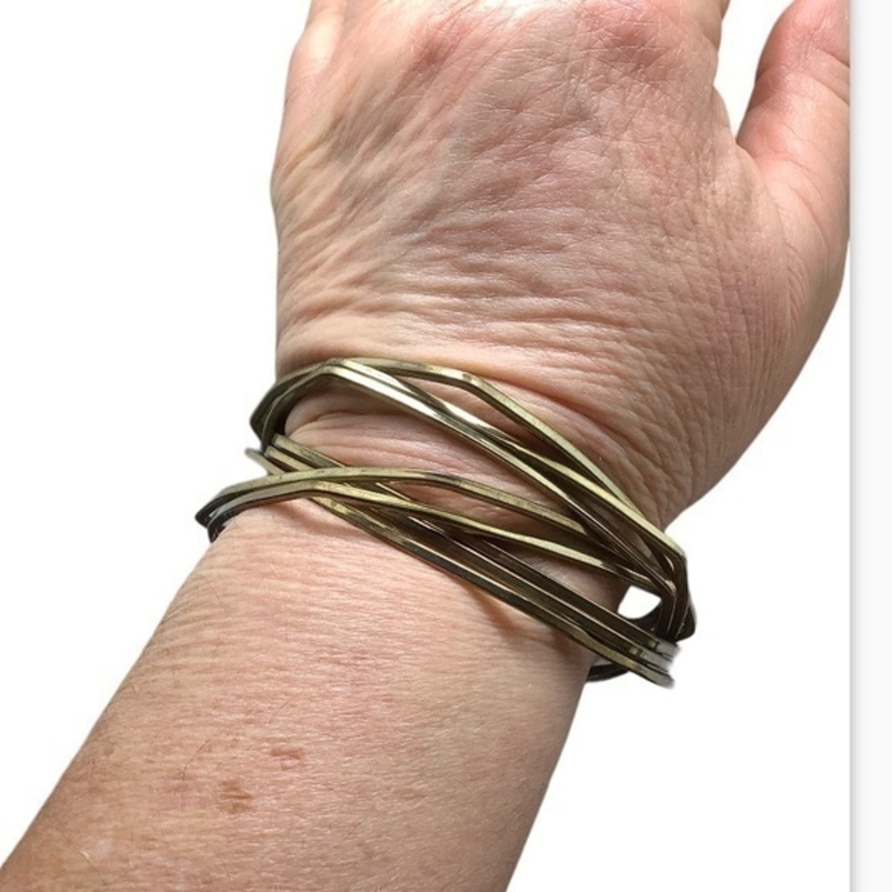 Gold tone intertwined, interlocking fashion unisex bangle bracelet